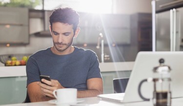 man scrolling in his phone
